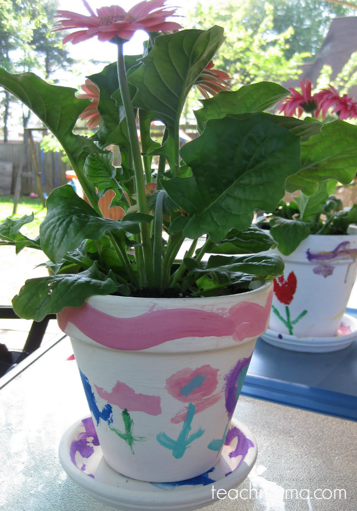 painted flower pots with daisy in it