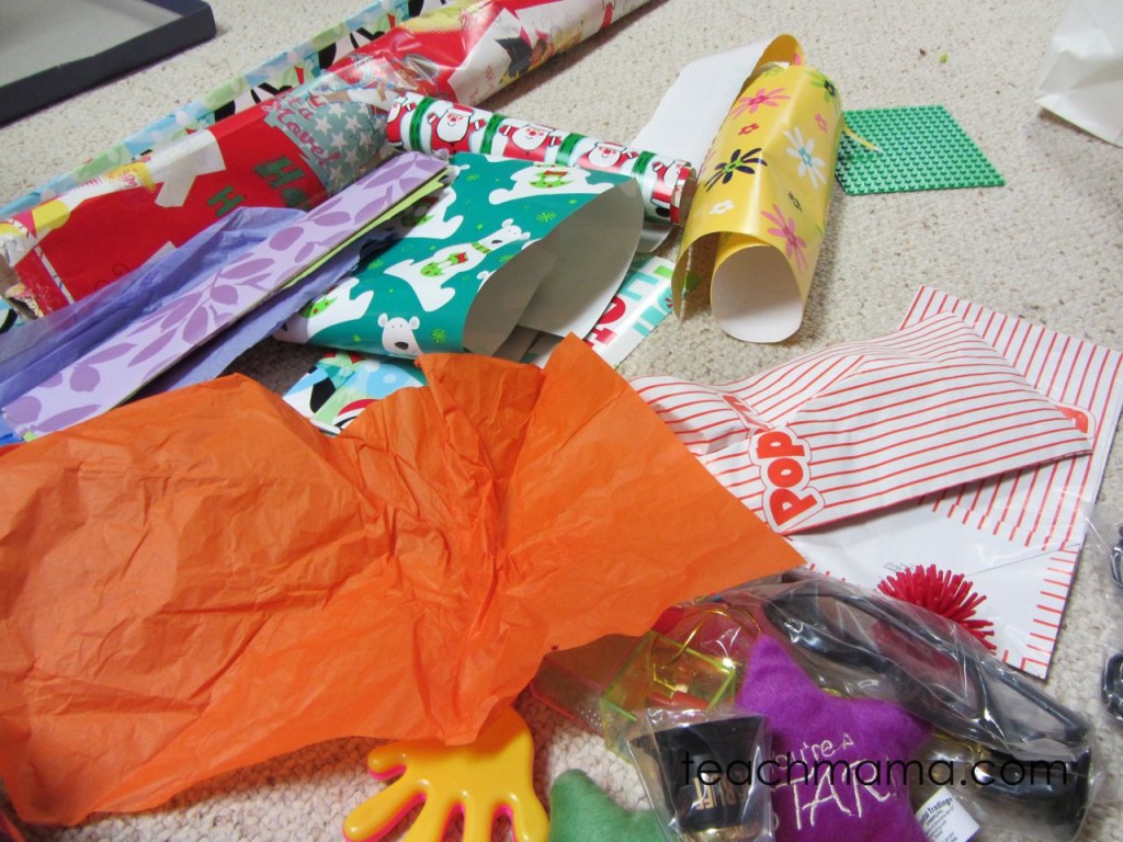 wrapping paper and prizes on floor