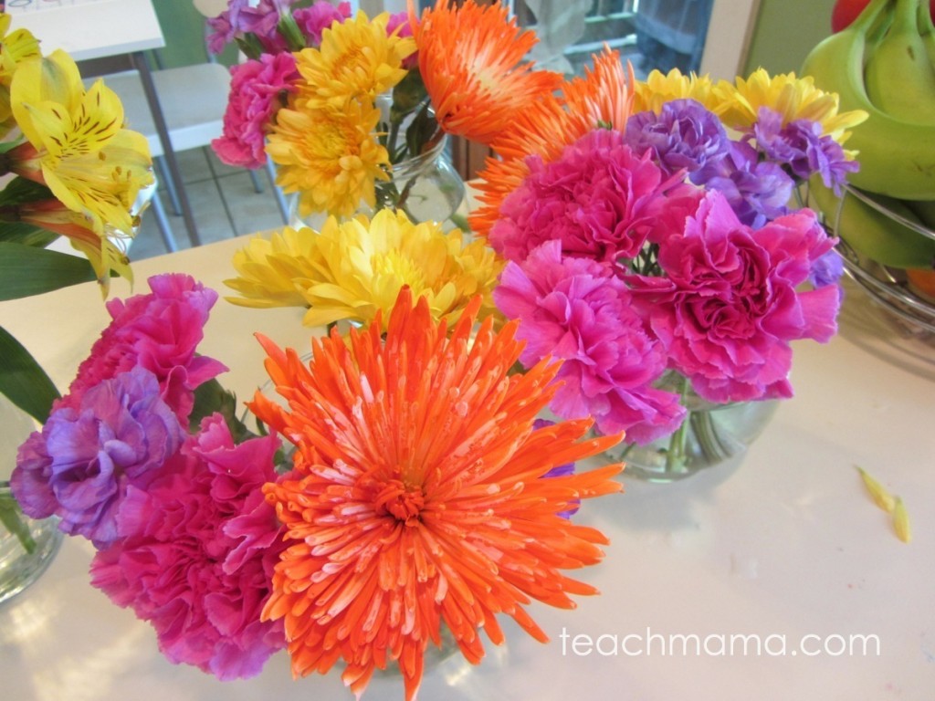 bright orange, pink, purple flowers in vases