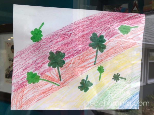 drawn picture with rainbow and shamrocks