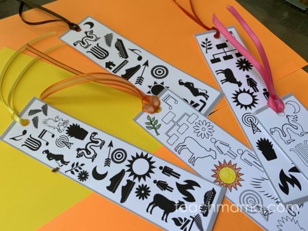 trials of apollo bookmarks on yellow and orange paper