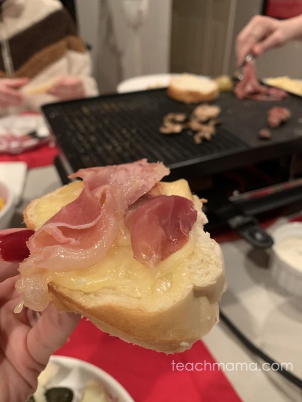bread, cheese, and meat in front of a raclette grill