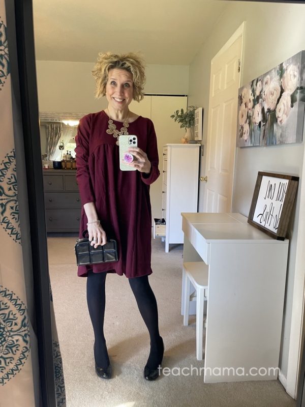 woman in burgandy dress with long sleeves
