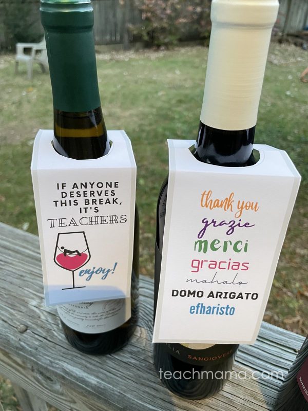 two bottles of wine with teacher gift tags on them