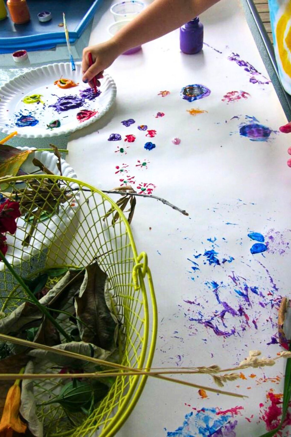child finger painting