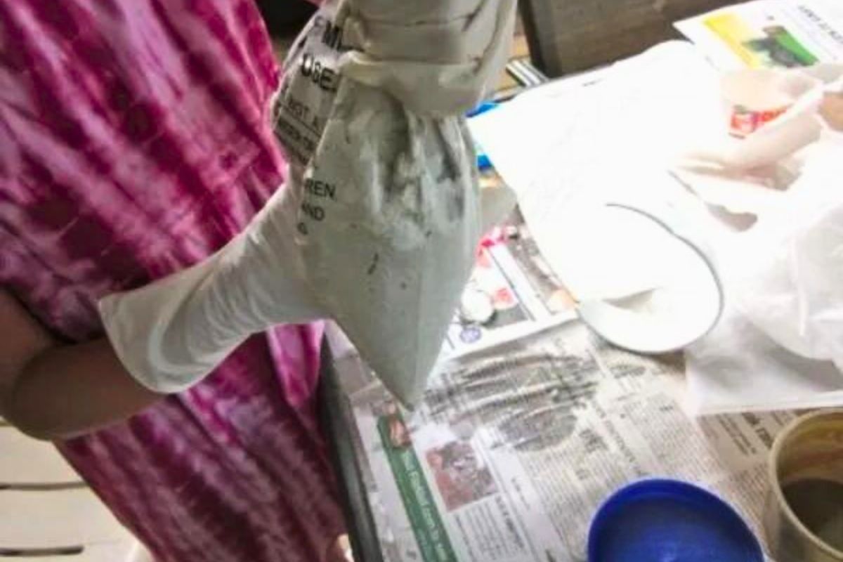 using grout bag to place mortar for DIY stepping stone