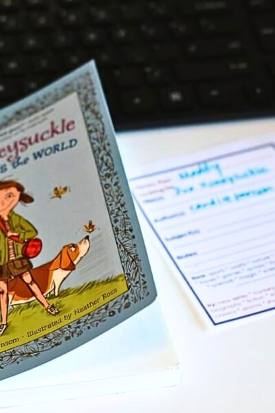 Child's book on a table with a printed library plan on the table next to it