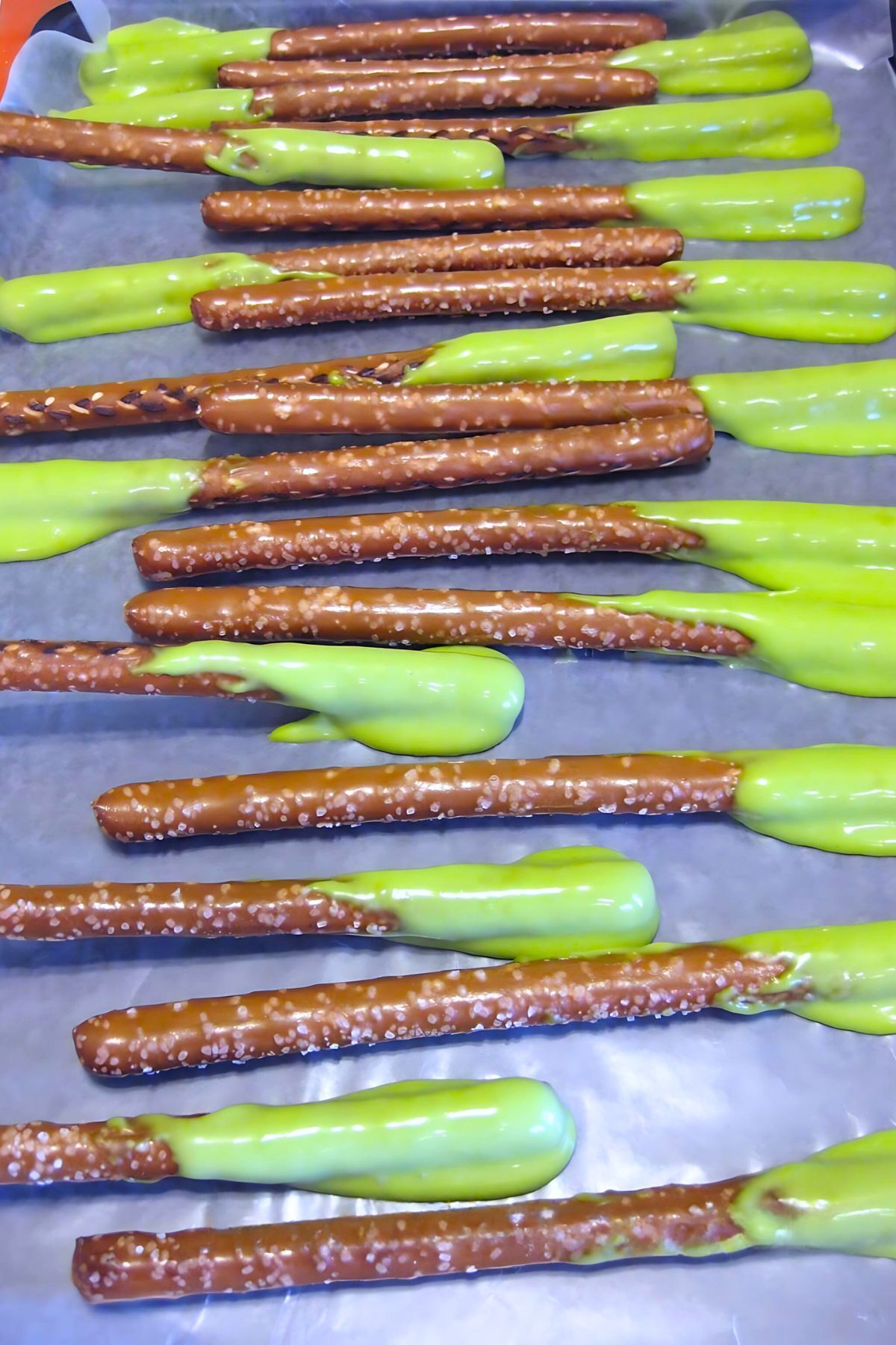 spooky halloween treats boogers, class party help for classroom parents Pretzel sticks with green icing on one end