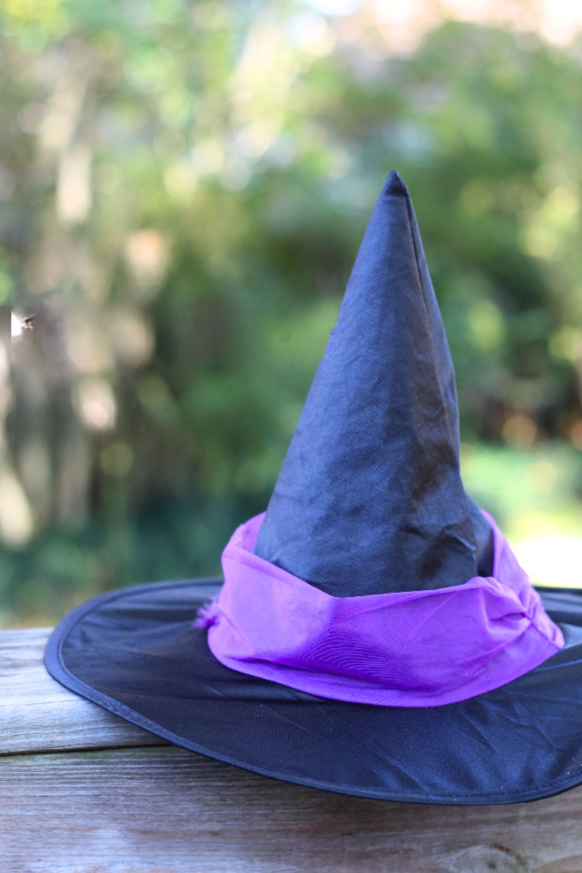 halloween class party ideas Dark blue witch's hat with a purple ribbon hat band