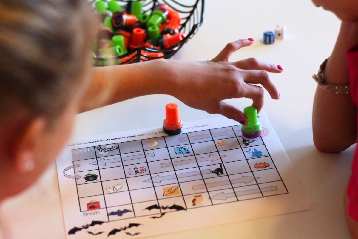 Girl playing the follow-the-path board game
