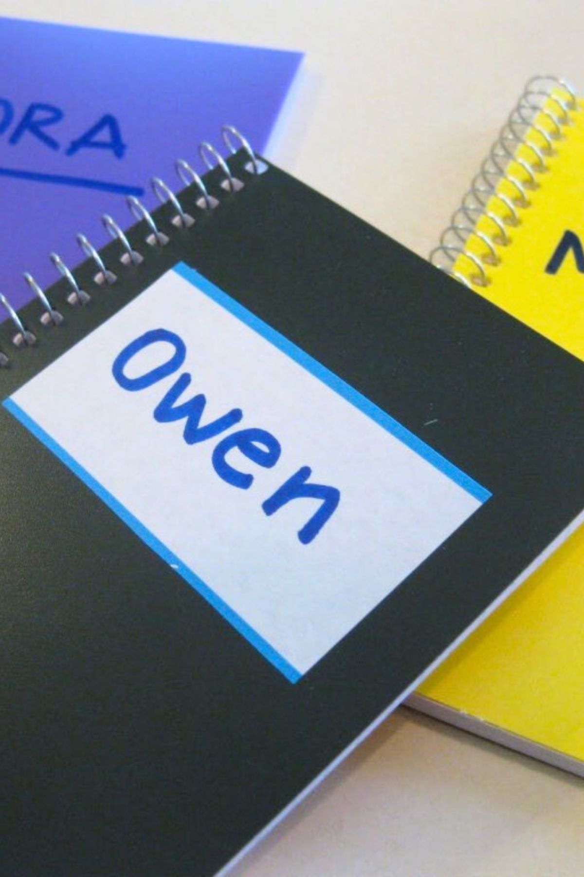 everyday name book Black spiral notebook with a name tag on front