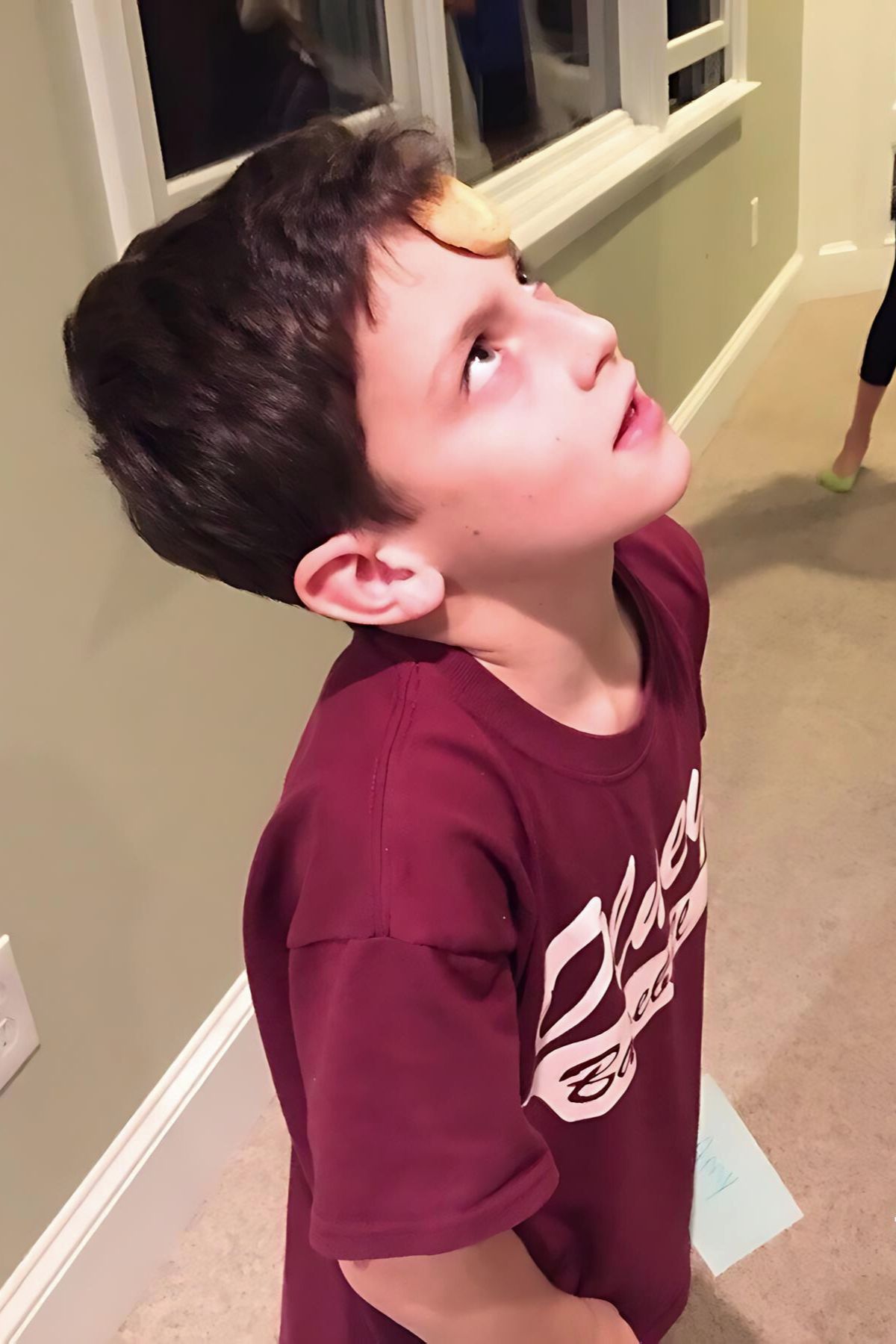 Boy with a Nilla wafer on his forehead