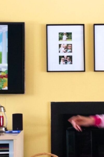 Girl dancing in front of a television to a children's dance video