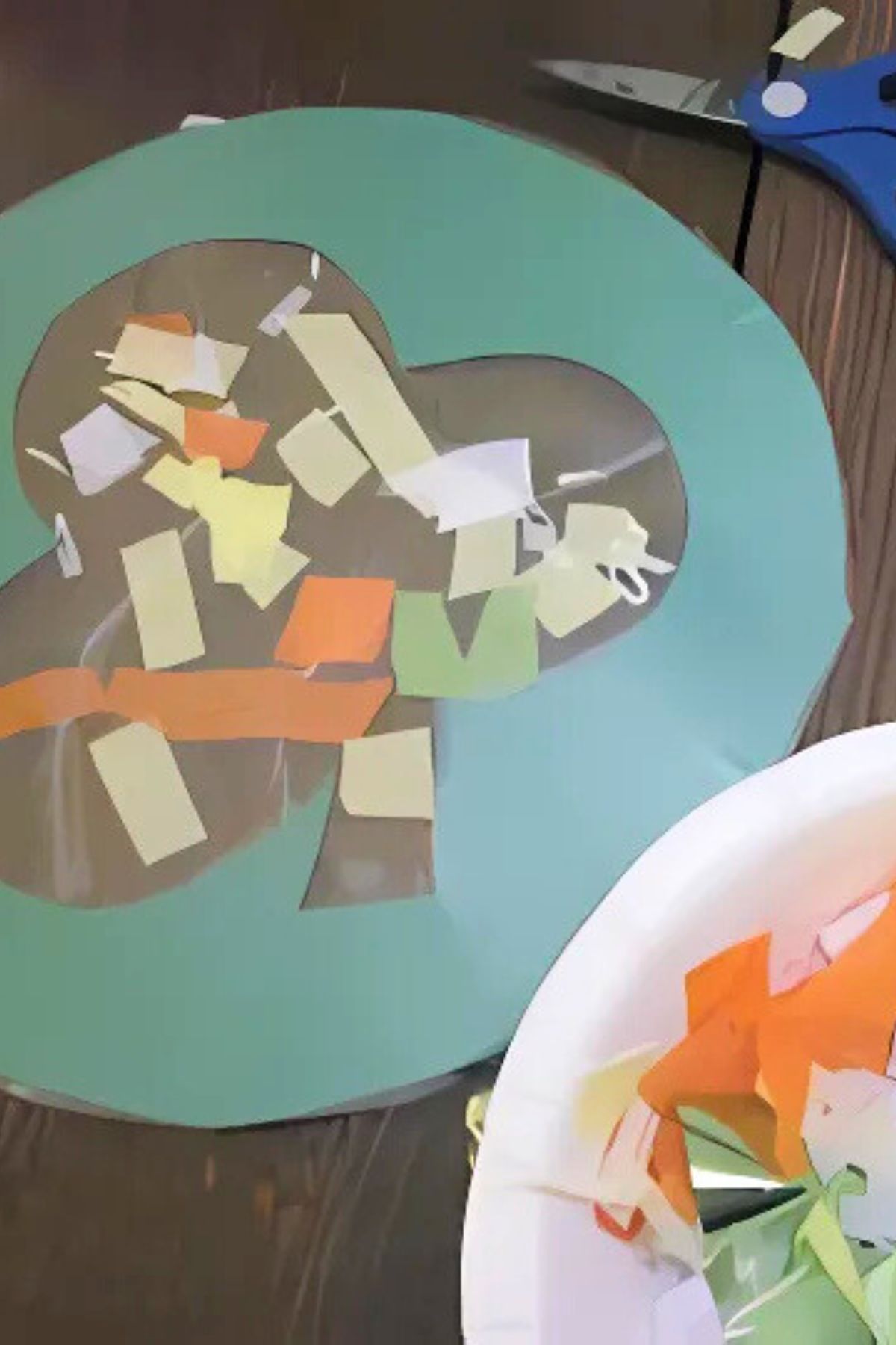 Shamrock cut-outs on a table with tissue paper decorations