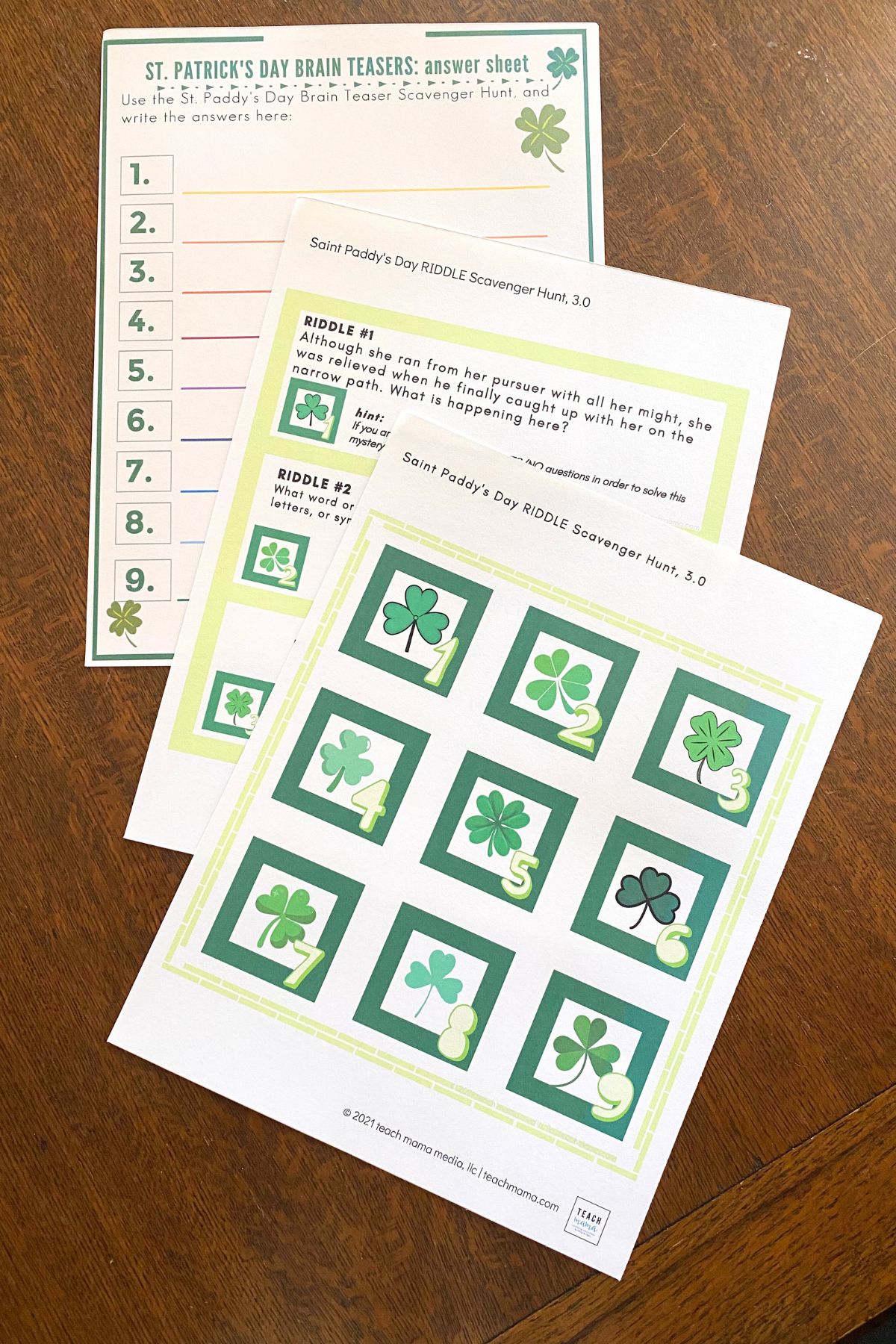 Brain teaser cards printed on white cardstock on a wooden table