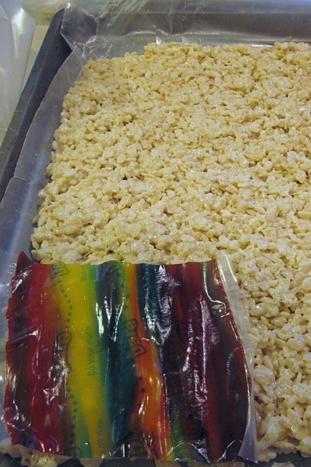 Rice Krispy Treats on wax paper with fruit roll-ups