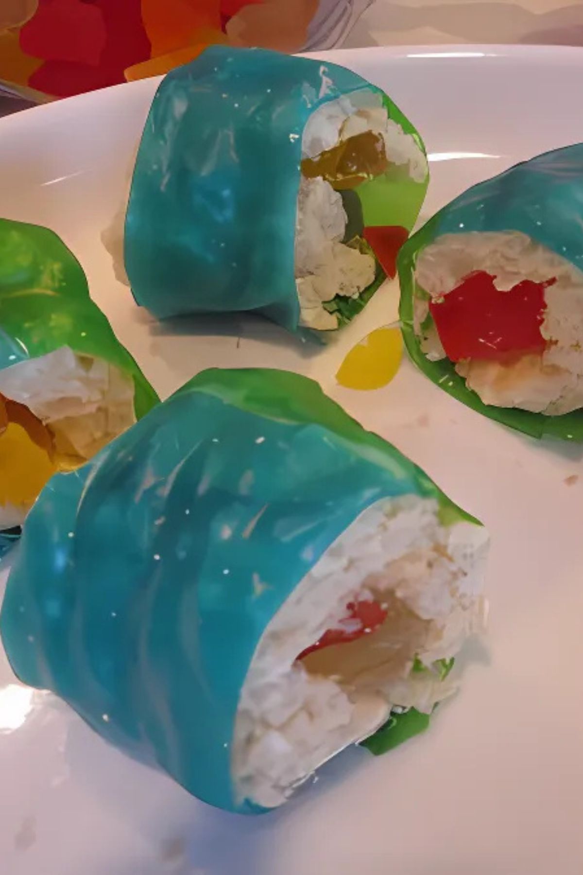 Candy sushi with fruit roll-up "seaweed," Rice Krispy treat "rice," and gummy fish in the center