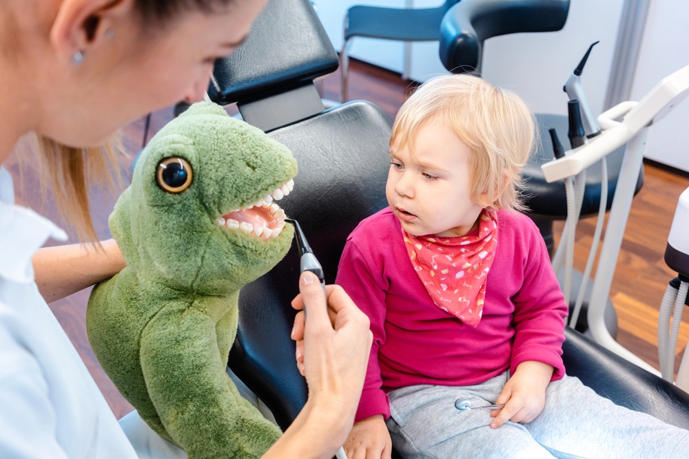 Teaching Child to brush with stuffed animal