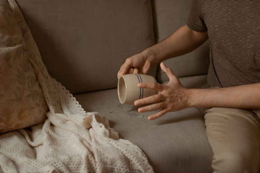 Spilled drink on sofa