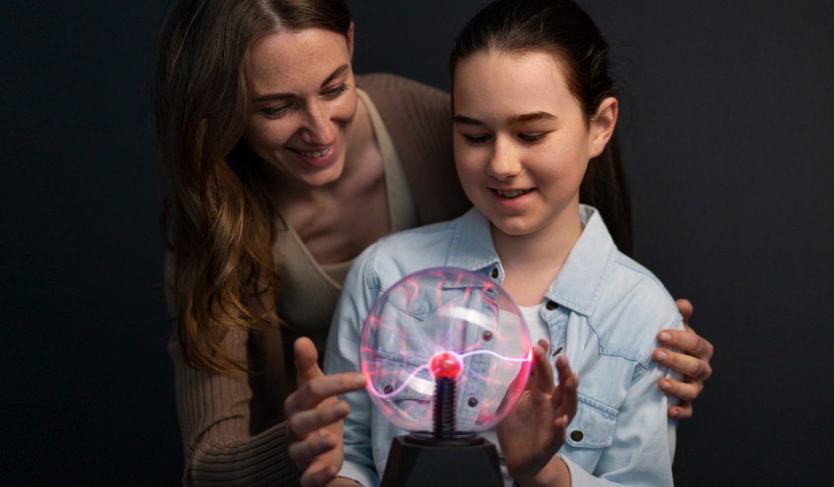 Woman and girl learning about energy