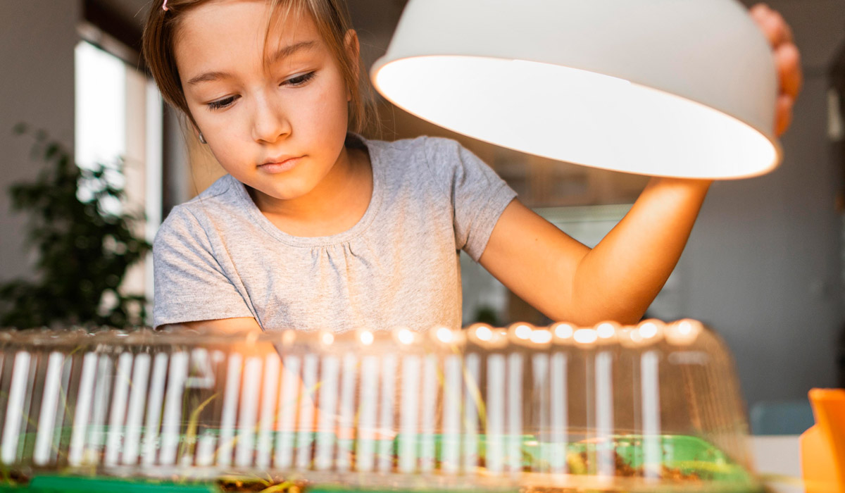 Young girl learning about light and power