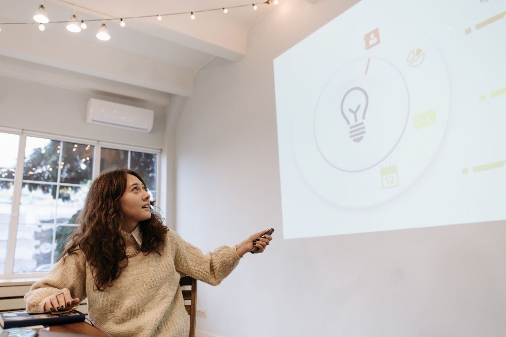 Teacher giving presentation to students